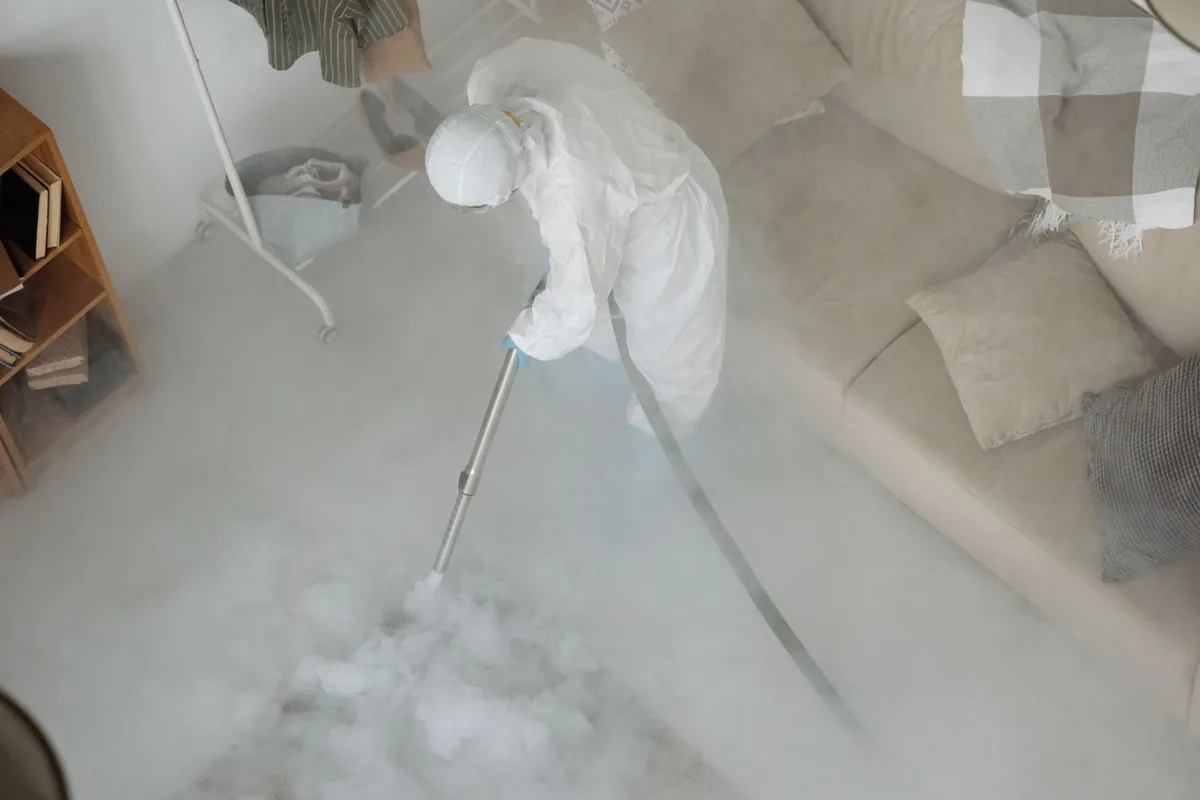 Biohazard cleanup technician in protective equipment, Peachtree Heights West, Atlanta, GA